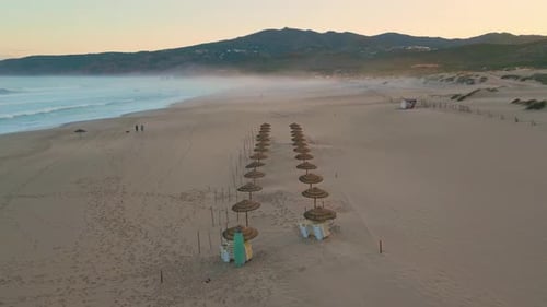 Sunset Beach Straw Umbrellas Drone Panorama Beige Sandy Surface with Footprints