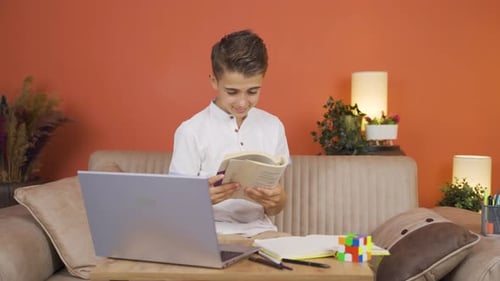The boy is very happy to read books.