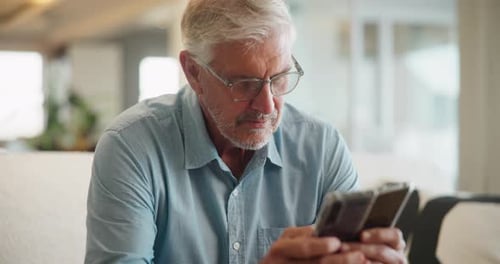 Senior Man With Gray Hair Using Smart Phone