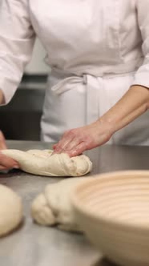 a chef makes bread in a bakery