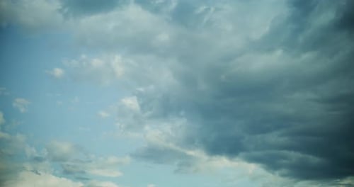 White Fluffy Clouds Floating in Blue Sky