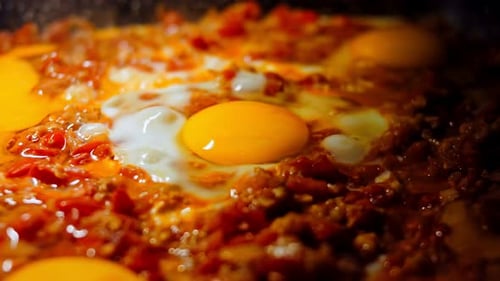 Close Up of Shakshuka Cooking in Pan