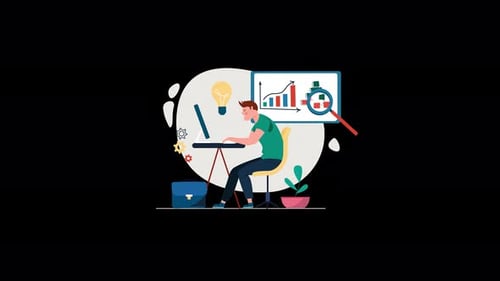 Man working on a laptop with graphs on a screen