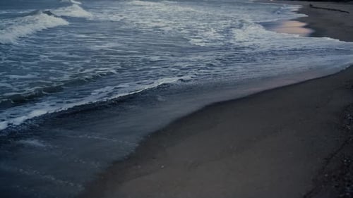 Dark Sea Waves Splashing Sandy Beach Outside. Blue Ocean Water Crashing Shore