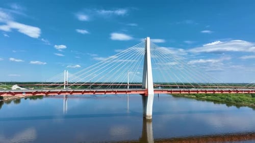 Drone shot of a modern cable-stayed bridge over a river