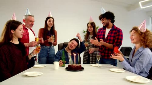 Colleagues Celebrate Birthday with Cake and Drinks