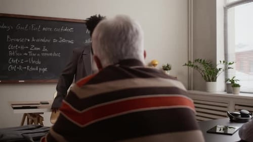 Teacher Explains Internet Concepts to Adult Learners