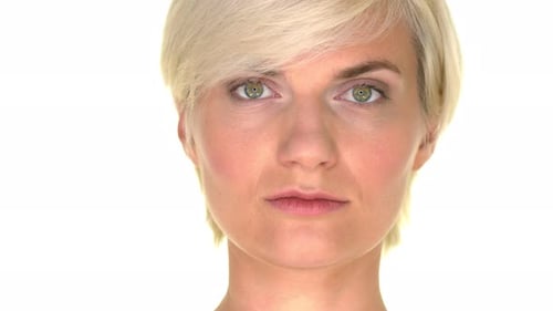 Portrait of an adult female with a calm and serious expression on a white studio background
