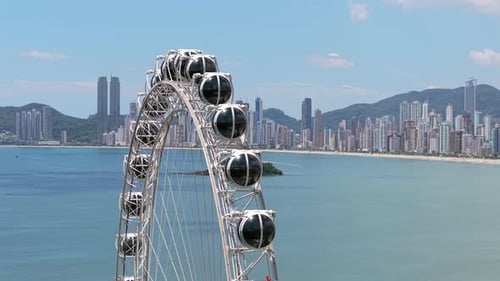 Landmark Ferris Wheel, Balneario Camboriu Cityscape in the background In Santa Catarina Brazil
