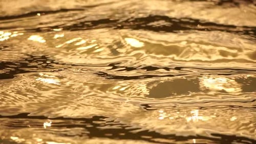 Sun Reflecting on Sparkling Sea Lake Water Surface Ocean at Sunset Sunrise Sunrays Flickering in