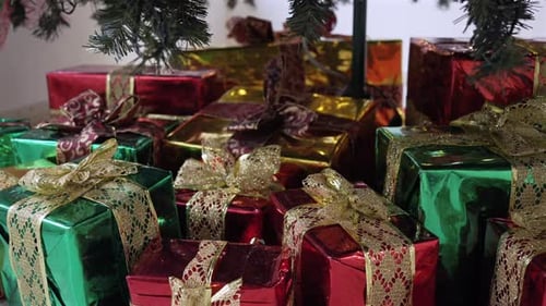Presents Under a Christmas Tree with Twinkling Lights