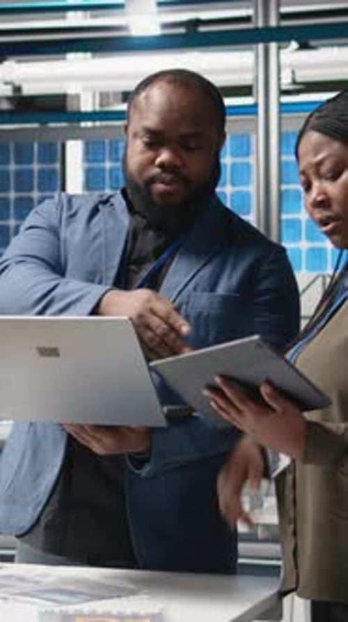 Man and Woman Working in Data Center