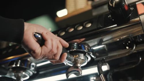 Professional preparing coffee.