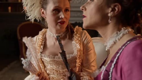 Women in Historical Costumes Chatting with Fans