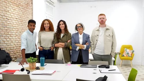 Diverse Business Team Smiling and Looking at the Camera in an Office