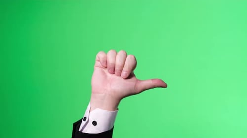 Male Hand on a Green Background