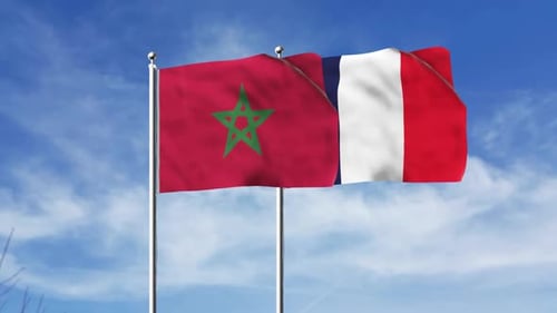 Waving Flags of Morocco and France on Flagpoles