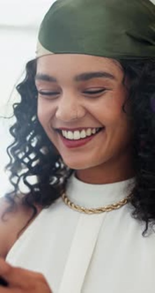 Smiling Woman Looking Down in Vertical Video