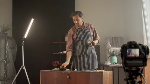 A Handsome Furniture Repairman in a Working Workshop Maintains an Online Tutorial on Repairing