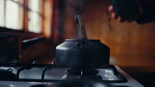 Boiling Tea In A Kettle Over Stovetop. Close-up Shot