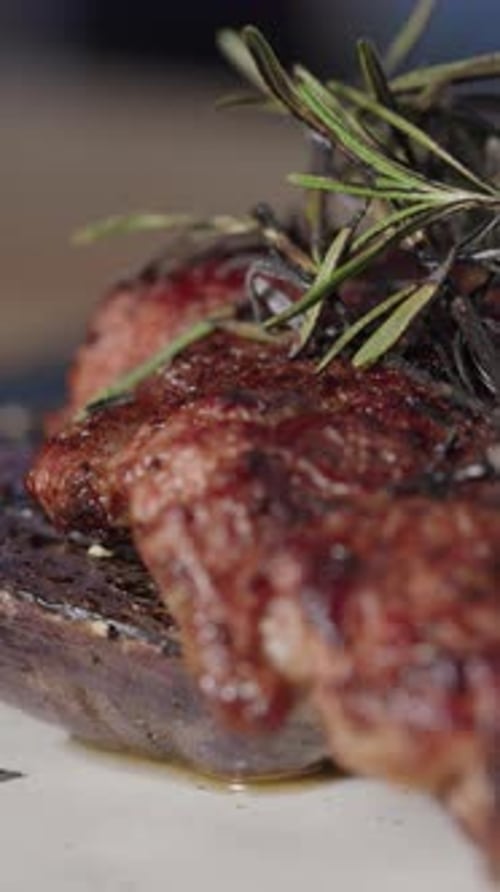 Delicious Grilled Steak with Fresh Rosemary Sprigs