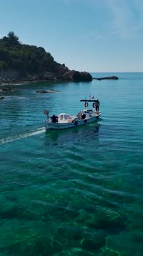 Vertical Video of Fishing Boat Working in Shallow Waters