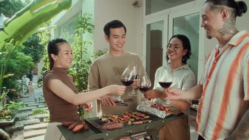Friends Having a Barbecue and Drinking Wine