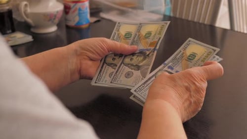 Close Up Counting US One Hundred Dollar Bills