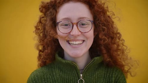 Woman With Red Curly Hair Smiling Close Up