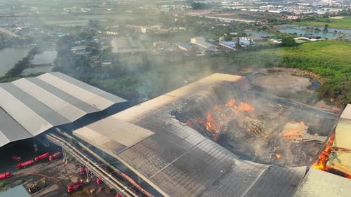 Aerial view captures a catastrophic fire at an industrial plant.