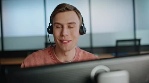 Joyful Man Assistant Speaking Computer in Data Center Closeup Smiling Operator