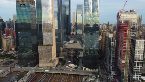 Drone rotating backwards in front of the Hudson Yards skyline, sunset in NYC