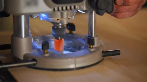Wood Router in Action Smoothly Cutting Into a Wooden Surface Shot Highlights Woodworking