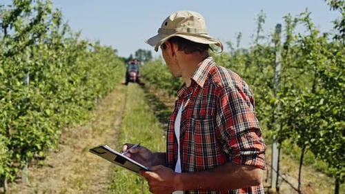 Man with Clipboard on Plantation