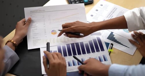 Business People Reviewing Data at a Table