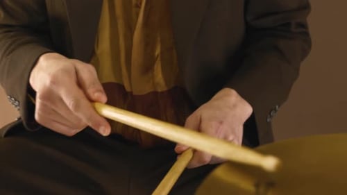 Drummer Beating The Hi-hat Cymbals And Snare Drum With Drumsticks - extreme close up
