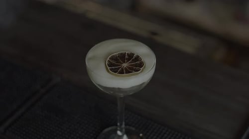 Close Up of Cocktail with a Slice of Dried Orange Fruite in Smoke Media Concept of Party at a Bar or
