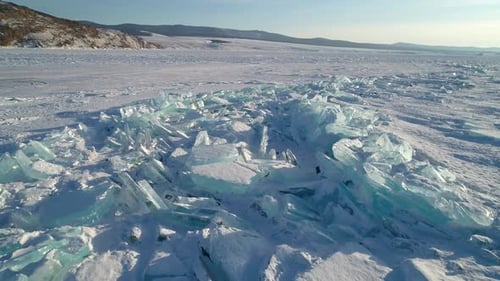 Aerial Over Crystal Clear Floes Hummocks and Blocks of Broken Unique Ice Lake Baikal Popular Tourist