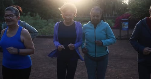 Senior People Running at City Park - Group of Elderly Friends Doing