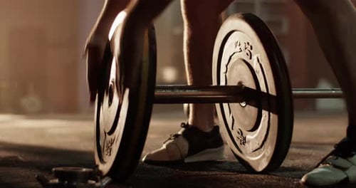 Adding Weight to Barbell at Gym