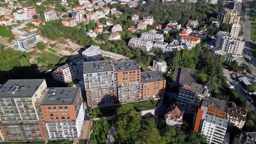 Aerial View of Modern Residential Complex Surrounded By Greenery in an Urban Area During Daylight