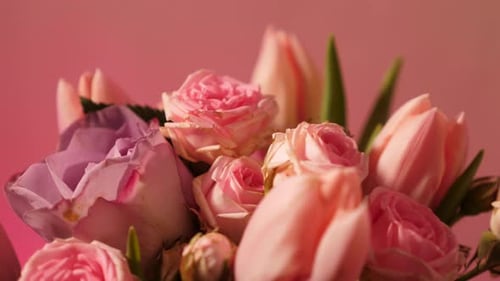Bouquet of Pink Spring Flowers on a Neon Background