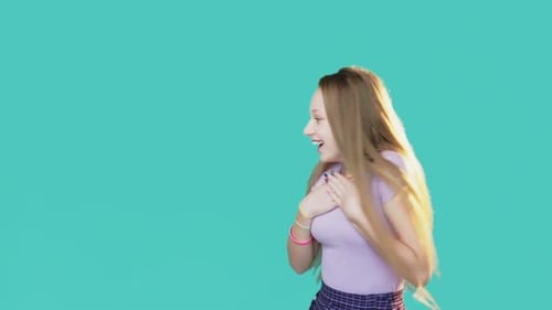 Excited Teen Girl Reacts to Something Off-Screen