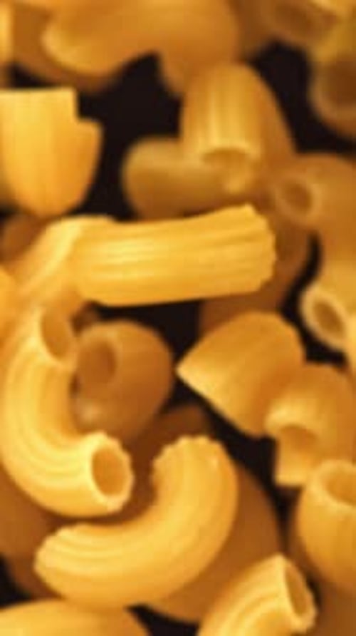 Super Slow Motion Flying Dry Macaroni Pasta Filmed on a Highspeed Camera at 1000 Fps
