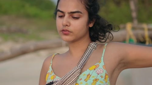 Nostalgic Girl on the Beach Enjoying the Sea at Sunset, Slowmotion
