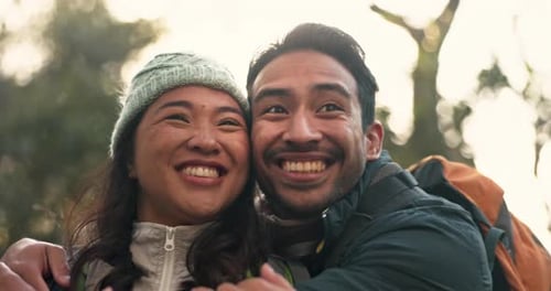Happy Couple Smiles in Sunny Forest