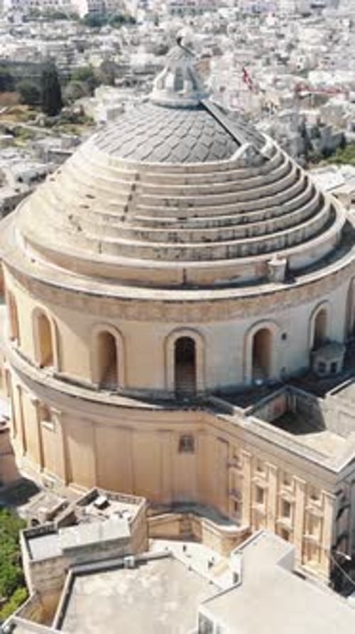 Aerial View of the Mosta Rotunda, Malta, Featuring Its Iconic Dome Structure. vertical video