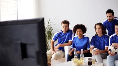 Friends Watch Game, Celebrate Exciting Sporting Event