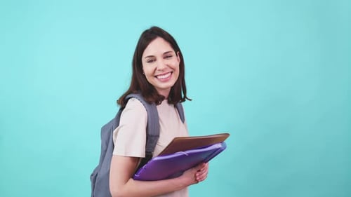 Smiling Student with Backpack and Notebooks