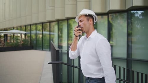 Confident Engineer Talking Walkietalkie Walking District Closeup Man Working